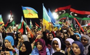 Libyan women waving the new Libyan flag and the flag of the Amazigh people – often called Berbers – during an Amazigh festival in Tripoli, 27 September 2011