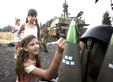 Israeli girl writes on a bomb