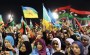 Libyan women waving the new Libyan flag and the flag of the Amazigh people – often called Berbers – during an Amazigh festival in Tripoli, 27 September 2011