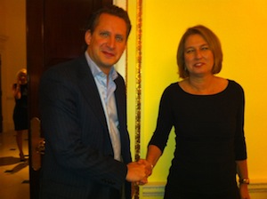 Gavin Stollar, Chair of Liberal Democrat Friends of Israel, warmly shakes hands with Israeli war crimes suspect Tzipi Livni
