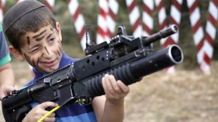 Israeli child holding a gun.jpg