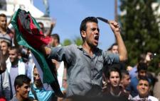 Palestinian protester wielding a knife