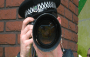 Policeman holding a camera